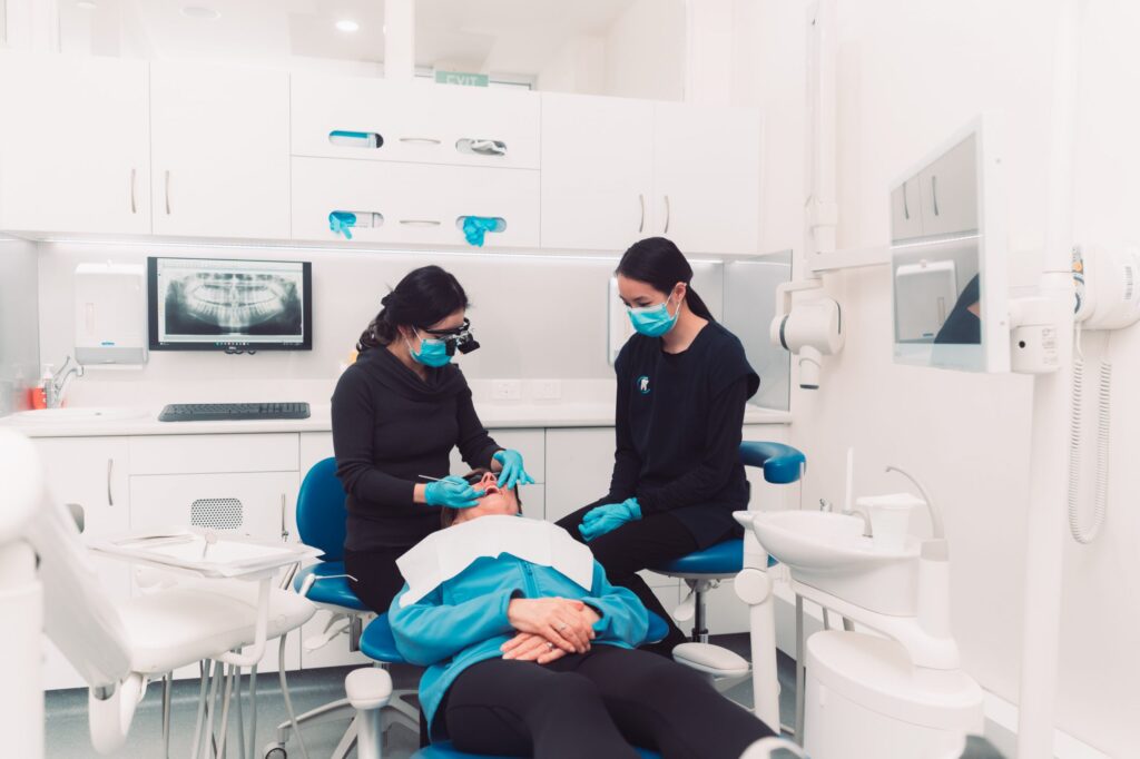 Two women sitting in a Surrey Hills dentist's office.